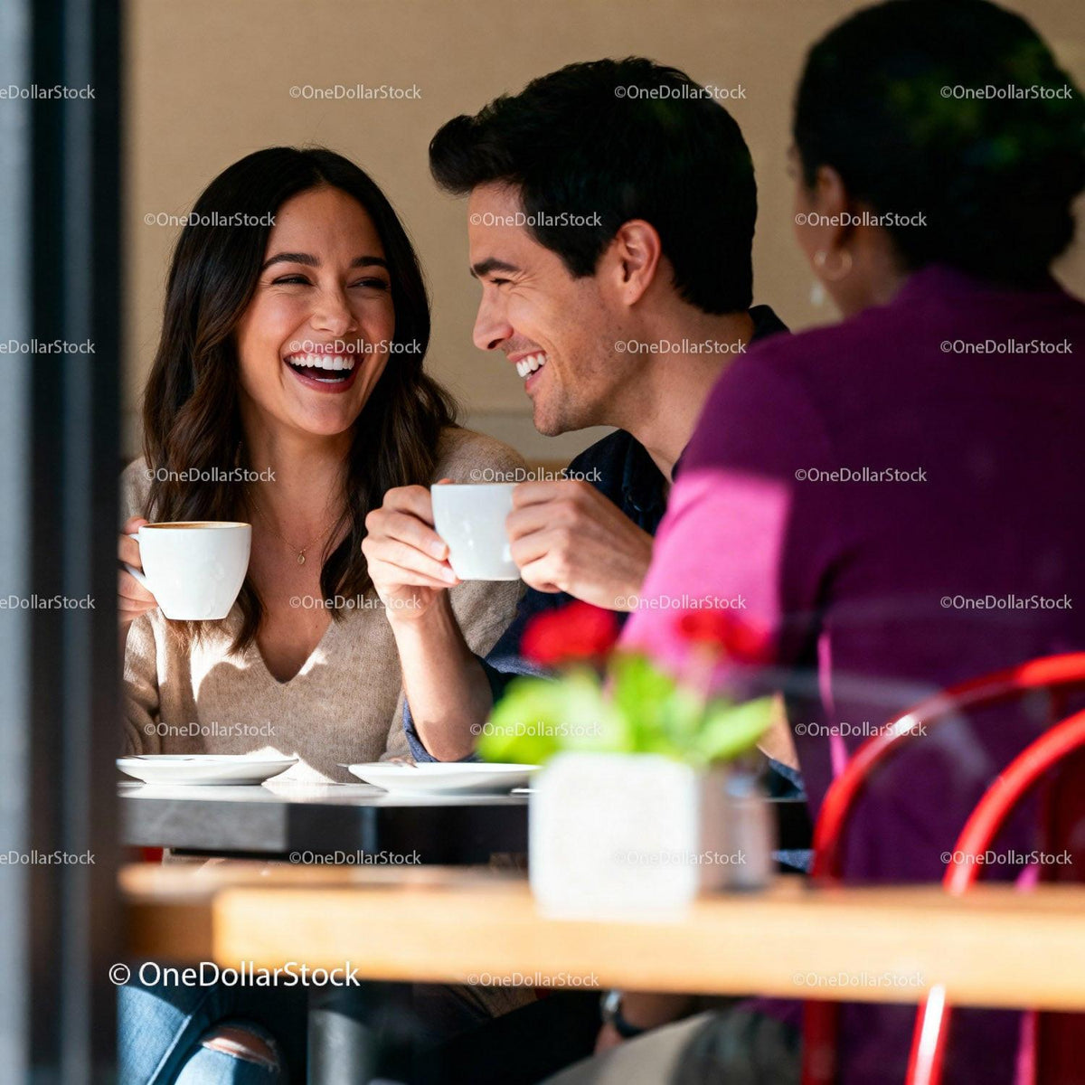 Couple sharing joyful coffee moment at cozy cafe