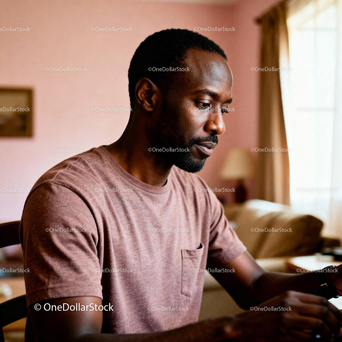 Thoughtful man focused on writing at home