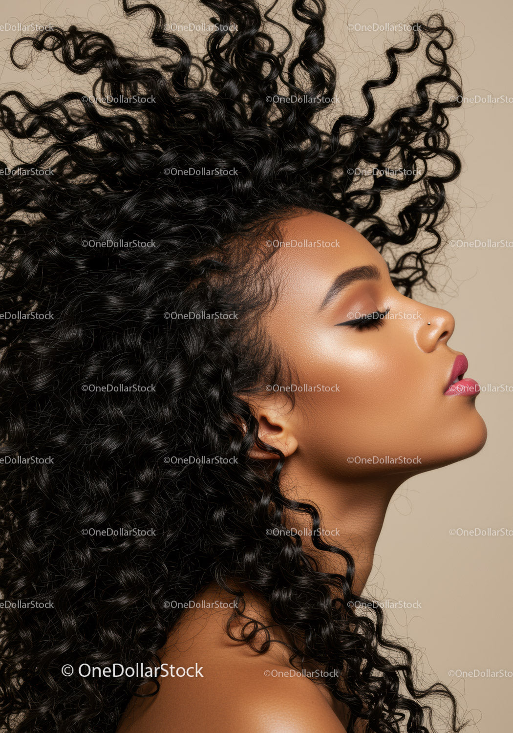 Profile of woman with voluminous curly hair in motion