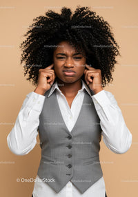 Frustrated Woman Covering Ears with Annoyed Expression