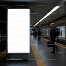 Blank illuminated display board in urban subway corridor