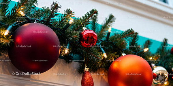 Festive Christmas Garland with Red and Orange Ornaments