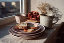 Ceramic Plates with Sliced Bread and Coffee Mug in Morning Light
