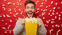 Cheerful Man Enjoying Popcorn on Red Background
