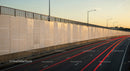 Urban Highway with Light Trails and Modern Infrastructure at Sunset