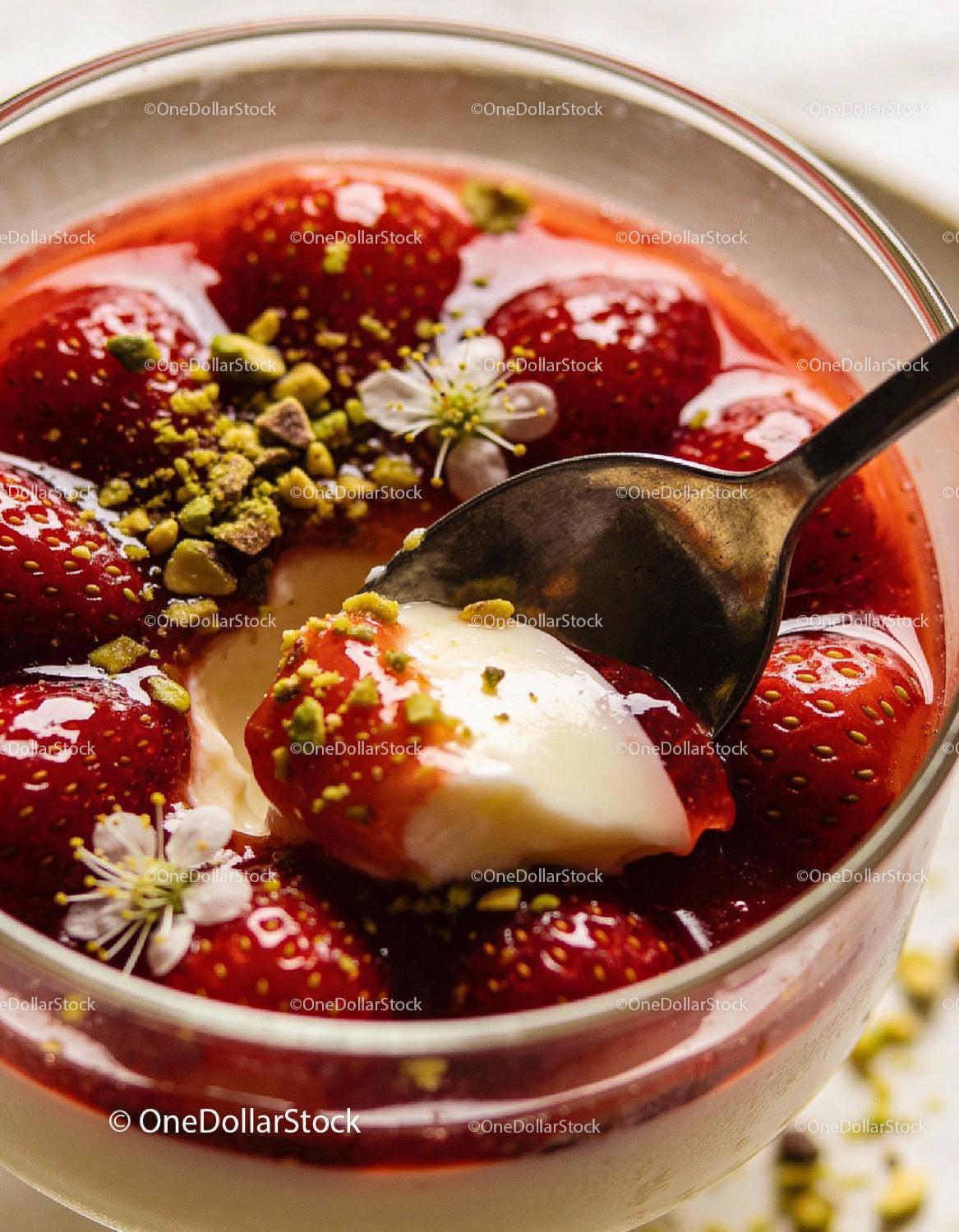 Close-up of creamy panna cotta with fresh strawberries