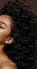Closeup of serene woman with long curly hair