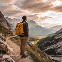 Hiker Enjoying Sunset View Over Mountain Valley