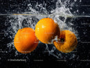 Vibrant Oranges Splashing into Water Creation