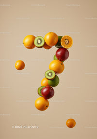 Fruits arranged in number seven on beige background