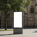 Modern blank advertising billboard in historic city square