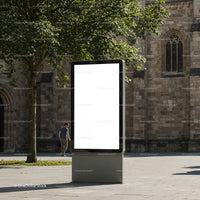Modern blank advertising billboard in historic city square