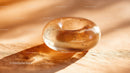 Luxurious Golden Glass Gemstone with Sparkling Glitter in Sunlight