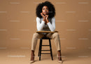 Thoughtful Woman Seated in Elegant Attire Against Brown Background