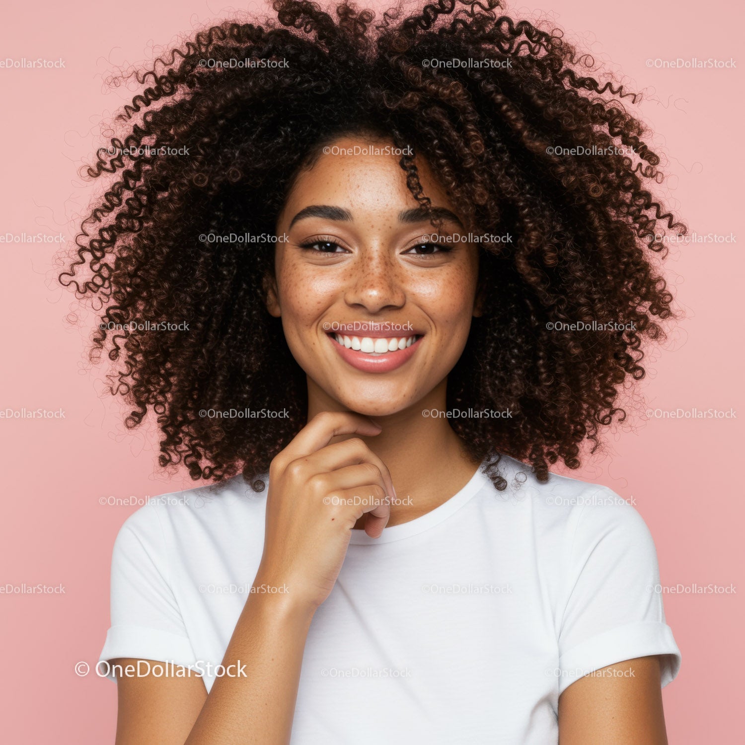 Young Woman with Curly Hair Smiling Portrait on Pink Background