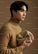 Stylish Male Model in Beige Sweater Holding Clutch for Fashion Portrait