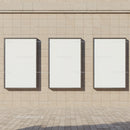 Three Blank Vertical Billboards on Stone Wall