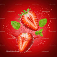 Fresh halved strawberries with mint leaves and splash