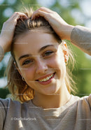 Happy Young Woman Enjoying Sunlight in Outdoors with Green Foliage