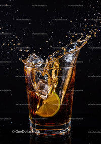 Refreshing Cola Drink Splash with Lime and Ice Cubes