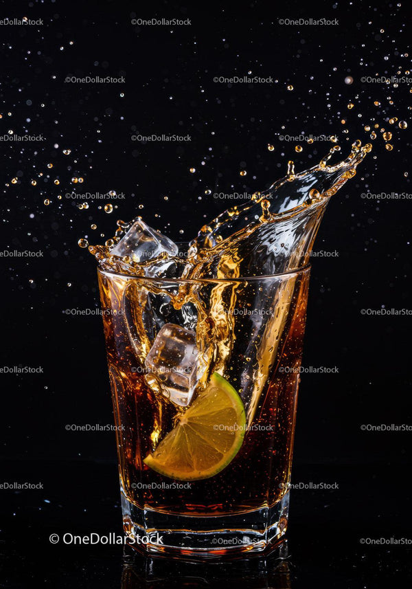 Refreshing Cola Drink Splash with Lime and Ice Cubes