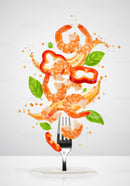Fresh shrimp and vegetables splashing from a fork