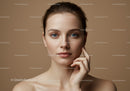 Elegant Portrait of a Young Woman with Clear Skin and Blue Eyes