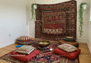 Cozy meditation corner with cushions and Tibetan singing bowl