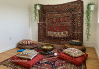Cozy meditation corner with cushions and Tibetan singing bowl