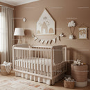 Stylish Nursery with Baby Crib, Cloud Decorations and Neutral Decor