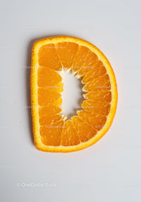 Close up of orange slice shaped like letter D