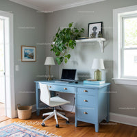 Bright Modern Home Office with Blue Desk and Green Monstera Plant