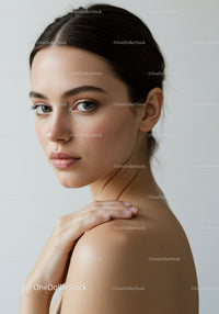 Beautiful Young Woman Portrait with Clear Skin and Soft Lighting