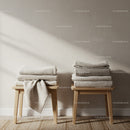 Stacks of Cozy Textured Blankets on Wooden Stools