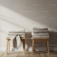 Stacks of Cozy Textured Blankets on Wooden Stools