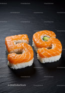 Salmon Sushi Rolls Shaped as Number 65 on Slate