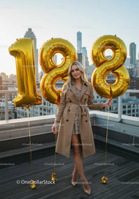 Elegant young woman celebrating 18th birthday with balloons