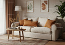 Cozy beige sofa with warm orange pillows in living room