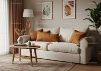 Cozy beige sofa with warm orange pillows in living room