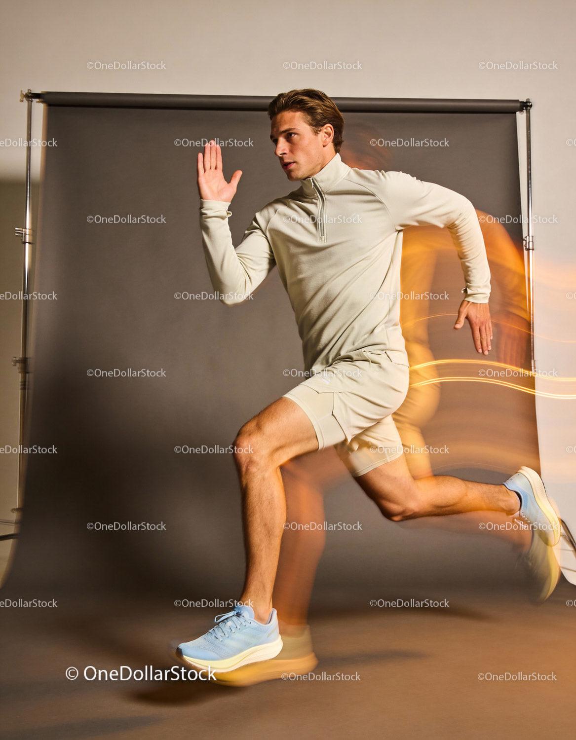 Athlete Sprinting with Focused Expression in Studio