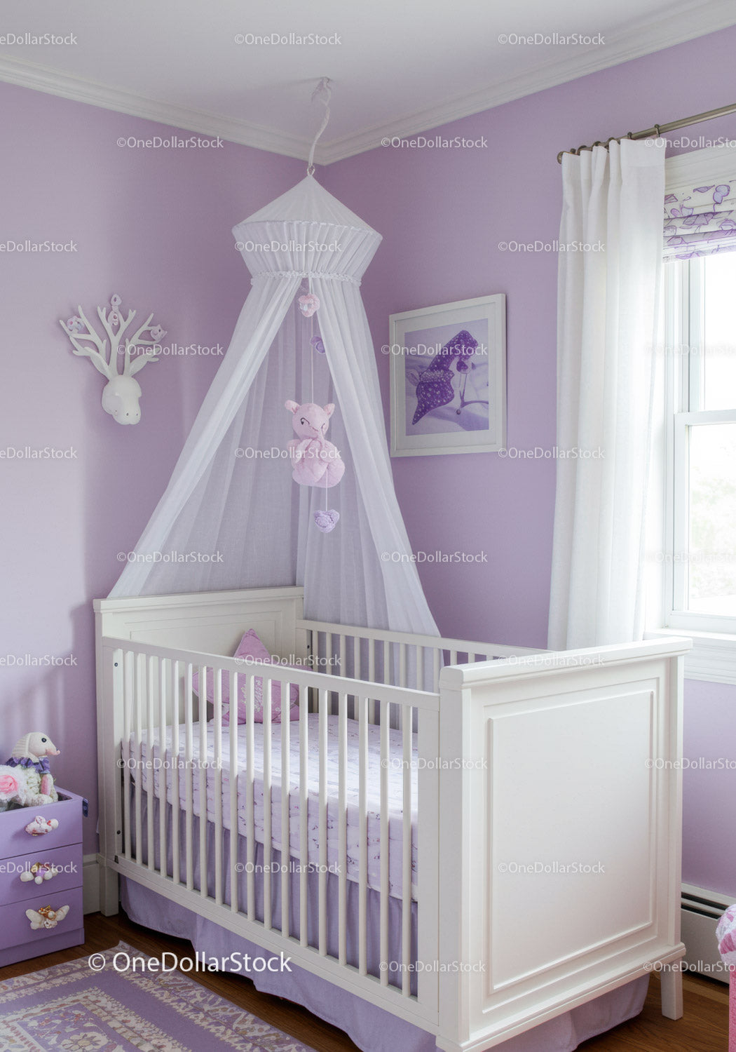 Elegant White Baby Crib with Purple Nursery Decor and Canopy