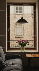 Cozy interior with flower vase by window light