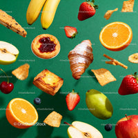 Assorted fresh fruits and pastries levitating on green