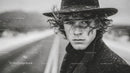 Stylish Young Man Wearing Fedora Hat in Black and White Portrait