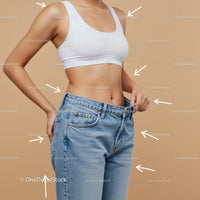 Slim Woman Measuring Waist in Casual Denim Jeans and White Sports Bra