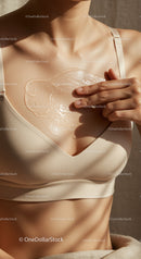 Woman Applying Serum on Chest for Skin Hydration and Glow