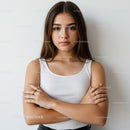 Portrait of a Confident Young Woman with Crossed Arms in Casual Style
