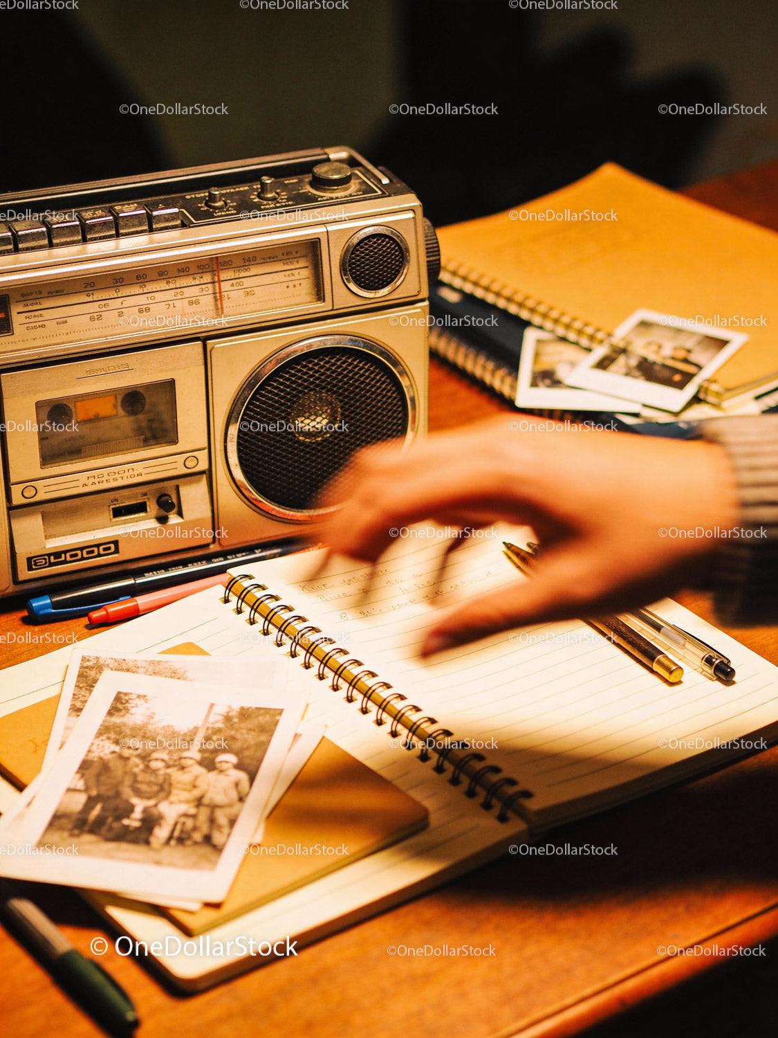Writing Memories Beside Vintage Radio and Old Photos