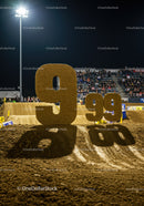 Large Dirt Number Nine at Nighttime Sports Event