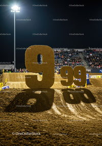 Large Dirt Number Nine at Nighttime Sports Event
